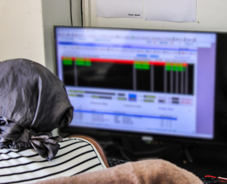 Security operator monitoring live camera feeds